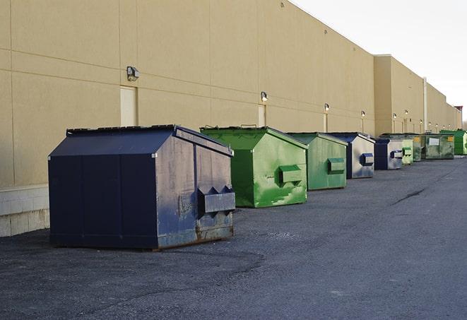 metal waste containers sit at a busy construction site in Mantorville